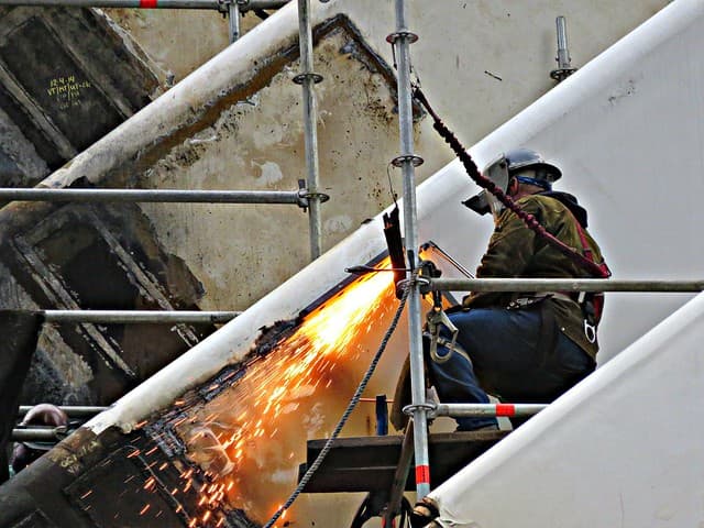 Experienced tradesperson welding confidently